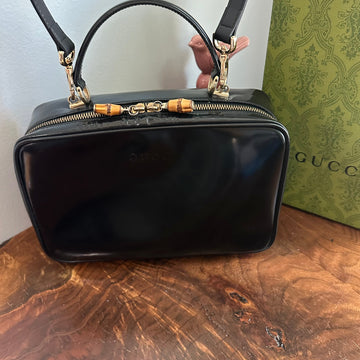 The Junco Crossbody/Clutch - Larger VS Gucci Bamboo Cosmetic Bag in Black Leather (Vertical)
